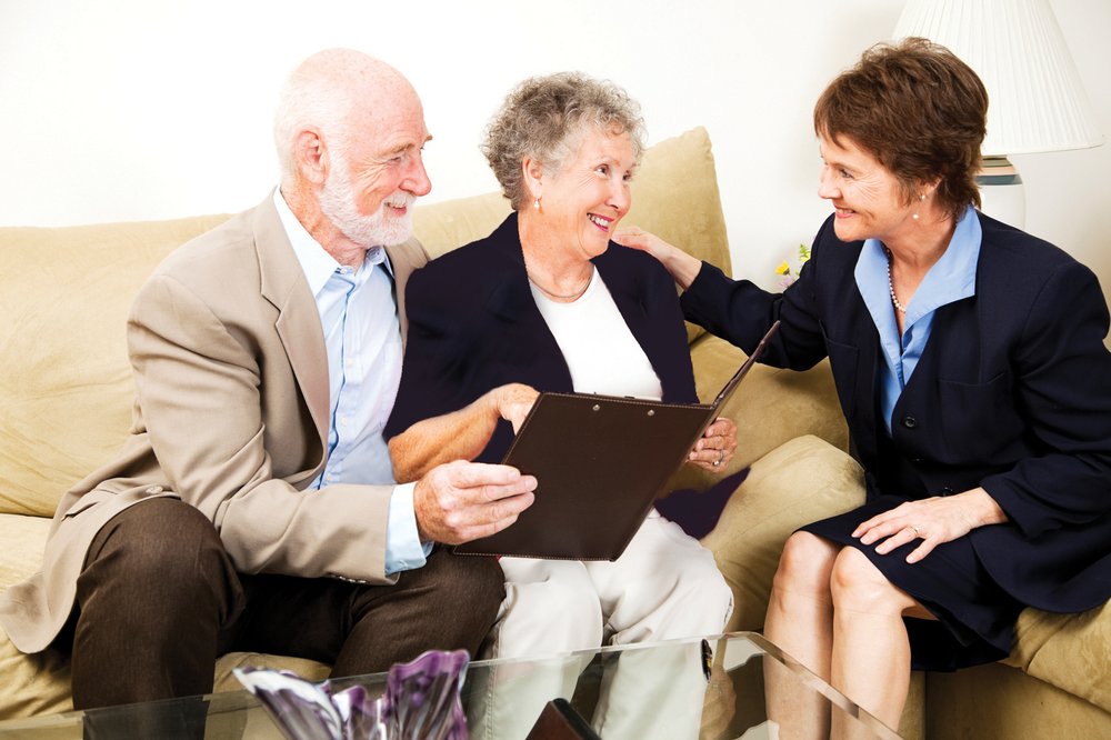 Smiling Couple With A Consultant